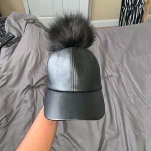 leather hat w/ puff ball